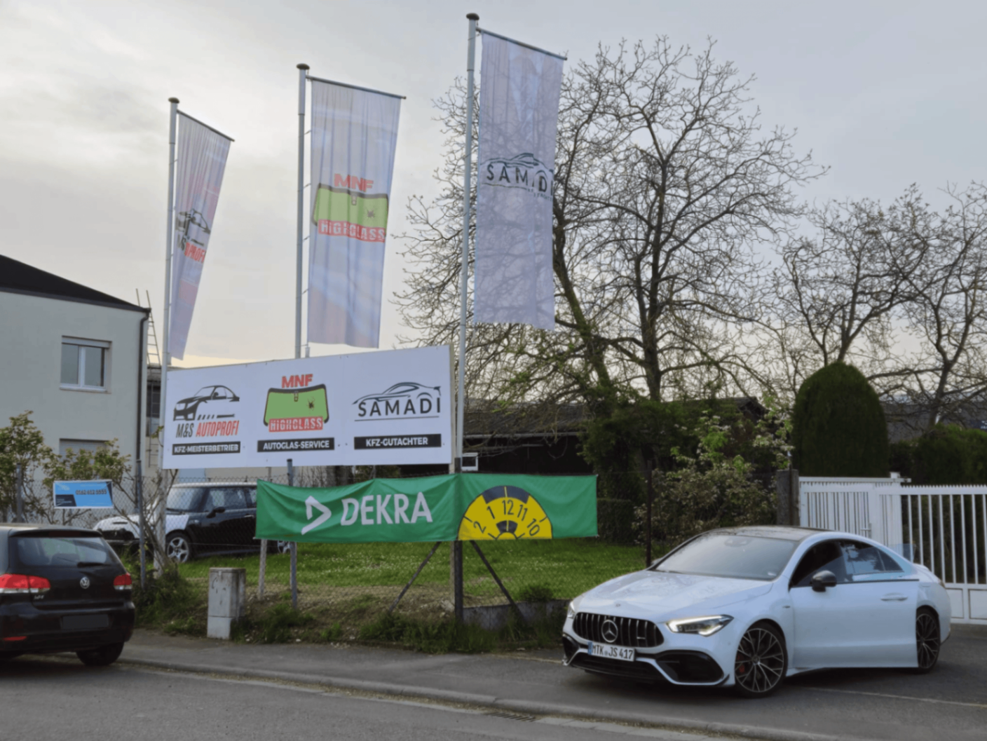 Standort KFZ-Gutachter Samadi mit Flaggen und Partnerbetrieben